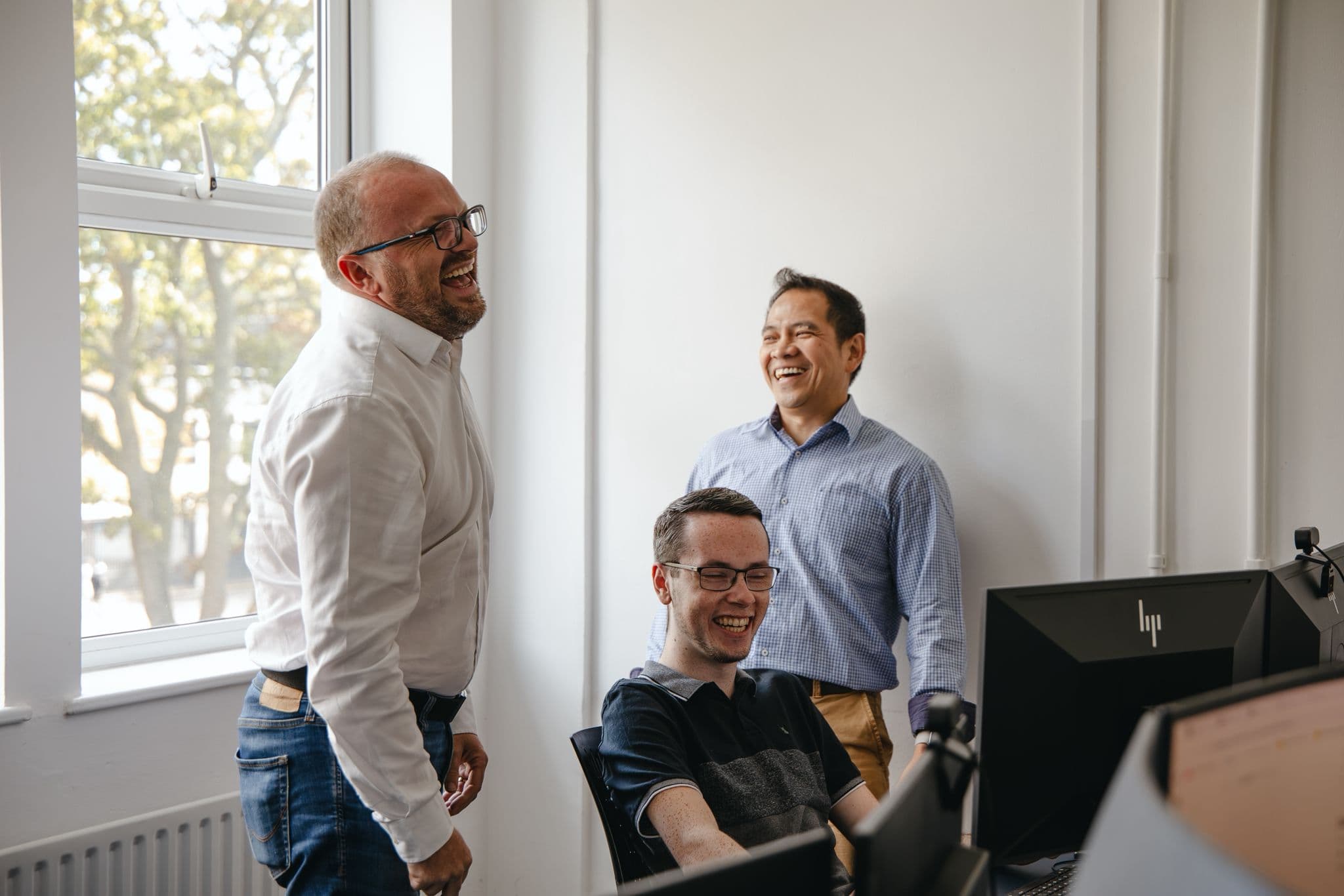 Joe and Charlie from the Cyber Trust team working with a client